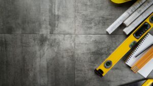 Contractor tools spread across wood floor