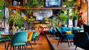 inside picture of restaurant with blue and yellow chairs