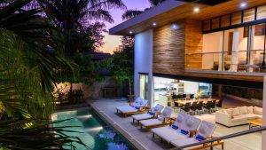 short term rental with pool and lounge chairs by the pool